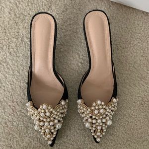 Black heels with pearls. Never worn.